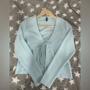 Light blue ribbed woman’s sweater/cardigan